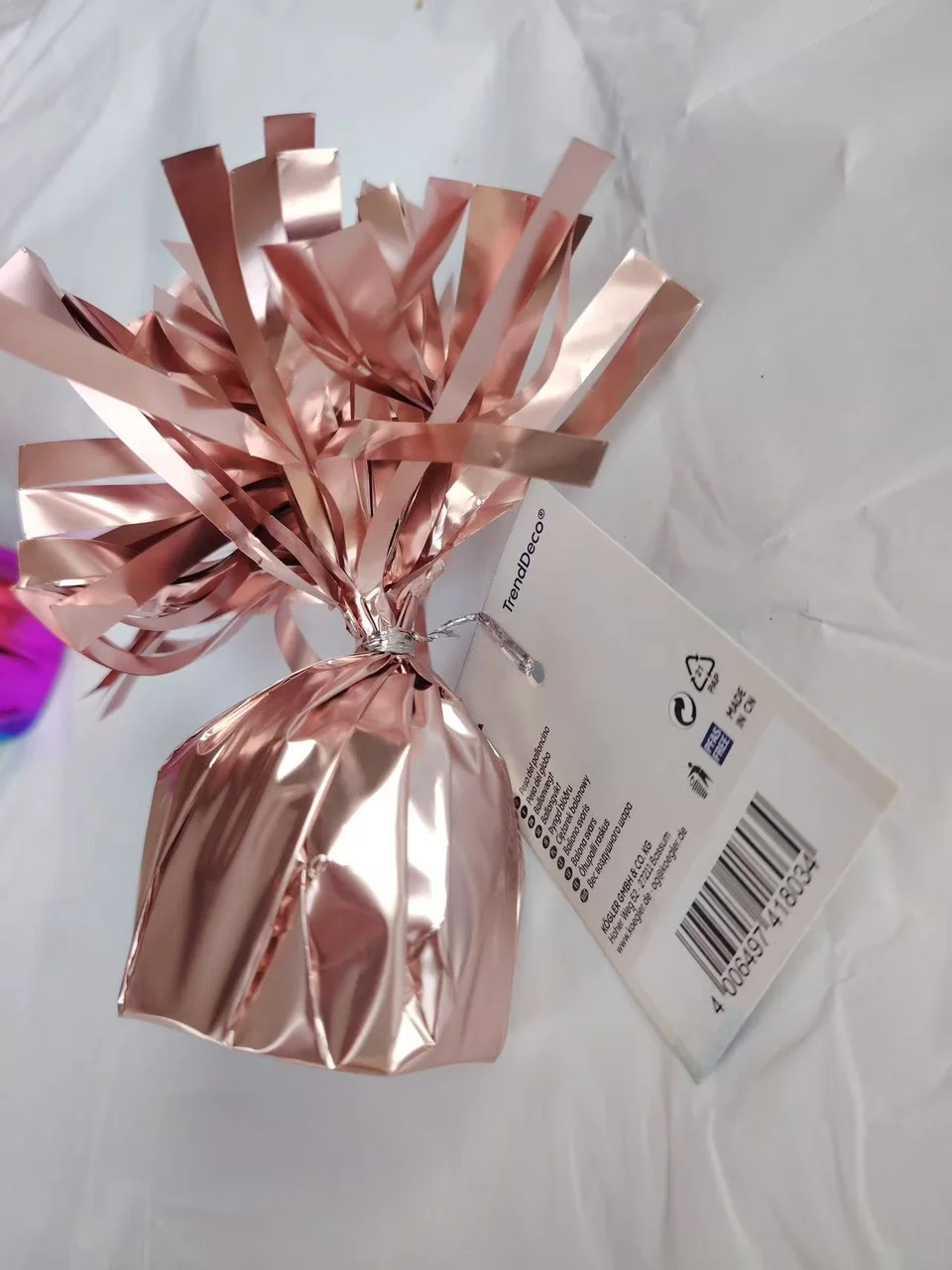 Rose gold 170g helium balloon weight with PET foil tassels and attachment loop